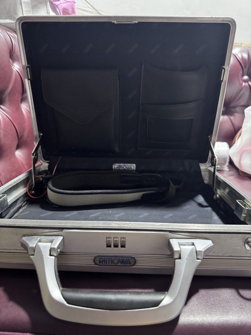 Rimowa Aluminum Briefcase (Category: Briefcases) located in Paranaque City. Submitted by destineshoppe (Listing ID 1436453220, Image 3). Description: - Authentic Rimowa aluminum briefcase - Silver exterior - Combination lock - Interior with multiple pockets and strap .