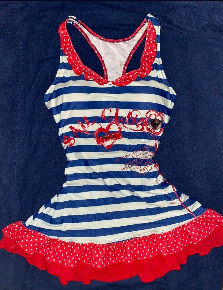 Sailor Striped Padded One Piece Swimsuit (Category: Bikinis & Swimsuits) located in Naga. Submitted by mria.001 (Listing ID 1436308176, Image 1). Description: Medium to Large - PADDED - One-piece swimsuit - Blue and white striped pattern - Red accents - Ruffled neckline and hem.