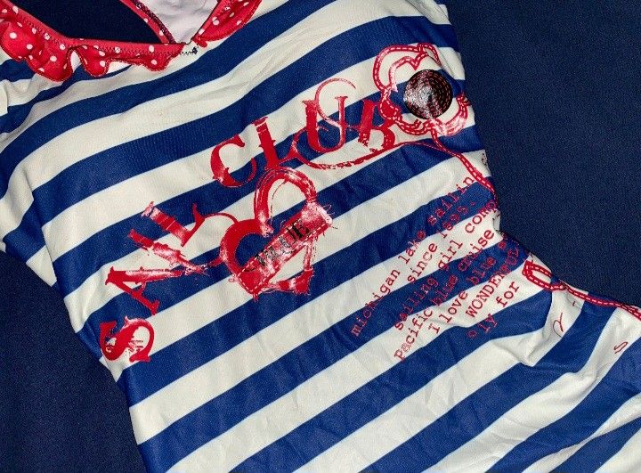 Sailor Striped Padded One Piece Swimsuit (Category: Bikinis & Swimsuits) located in Naga. Submitted by mria.001 (Listing ID 1436308176, Image 3). Description: Medium to Large - PADDED - One-piece swimsuit - Blue and white striped pattern - Red accents - Ruffled neckline and hem.