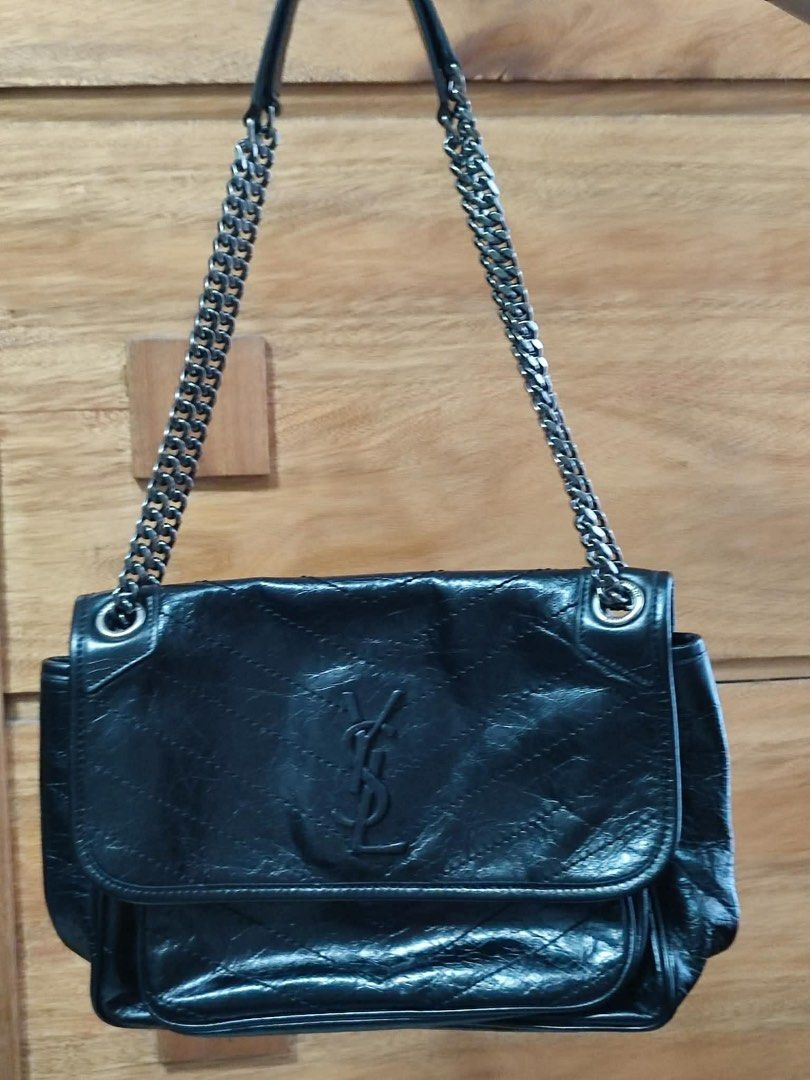 Saint Laurent Medium Niki Bag (Category: Luxury Bags & Wallets) located in Manila. Submitted by shersantos (Listing ID 1436448614, Image 1). Description: - Saint Laurent black leather shoulder bag - Chain strap - Flap closure with YSL logo - Includes dust bag - Interior: zippered pocket and snap closure pocket - Quilted design - Saint Laurent Paris logo visible 🖤 FOR SALE: Saint Laurent Medium Niki Bag 🖤 Timeless, edgy, and effortlessly cool — 
