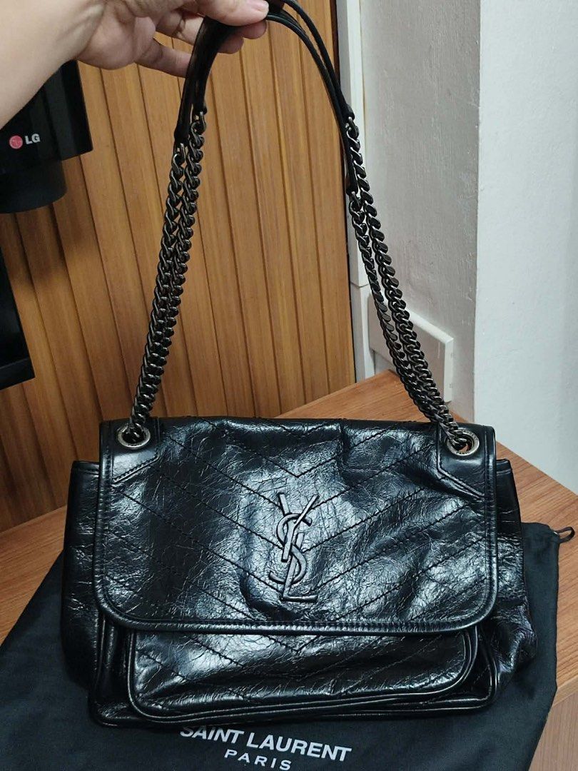 Saint Laurent Medium Niki Bag (Category: Luxury Bags & Wallets) located in Manila. Submitted by shersantos (Listing ID 1436448614, Image 3). Description: - Saint Laurent black leather shoulder bag - Chain strap - Flap closure with YSL logo - Includes dust bag - Interior: zippered pocket and snap closure pocket - Quilted design - Saint Laurent Paris logo visible 🖤 FOR SALE: Saint Laurent Medium Niki Bag 🖤 Timeless, edgy, and effortlessly cool — 