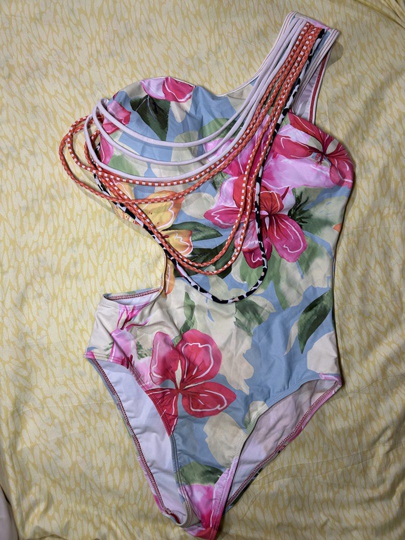 SHEIN Floral One-Sided Swimsuit (Category: Bikinis & Swimsuits) located in General Trias. Submitted by lilzariyahhhh (Listing ID 1436335835, Image 1). Description: - Floral print one-shoulder swimsuit - Unique design with braided straps - Stylish side cutout detail - Comfortable one-piece style - Ideal for beach and pool days - Lightweight fabric - S to M (B: 32-34, W: 27-28) -with og pouch.