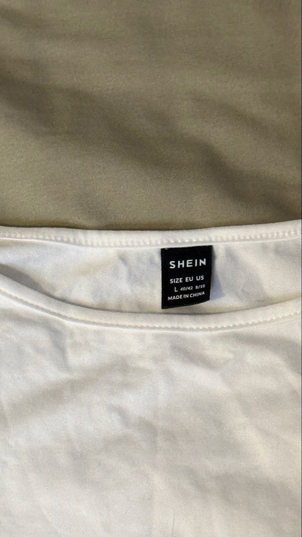 SHEIN White Long Sleeve Top - Size L (Category: Blouses) located in Manila. Submitted by strawboreos (Listing ID 1436328647, Image 2). Description: - SHEIN white long sleeve top - Size: L - Features a round neckline - Fitted silhouette - Made from a smooth, lightweight fabric - Perfect for layering or wearing alone - Simple design, versatile for different outfits.