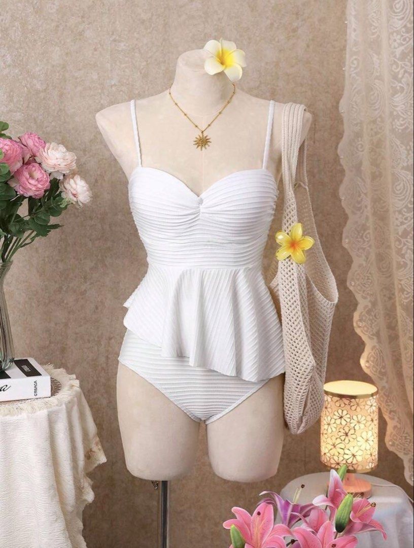 Shein White Textured Two-piece Swimsuit (Category: Bikinis & Swimsuits) located in Quezon City. Submitted by deux.ph (Listing ID 1436433840, Image 3). Description: DIMENSIONS: Small on tag • Bust: 34.60 in. • Underbust: 26.40-36.30 in. • Top length: 15.70 in. • Waist : 24-25 in. • Hips : 30-34 in. • Length (waist to hem) : 11.80 in. COLOR: White DETAILS: - this size is sold out on their site - textured fabric, thick, high quality and very well-ma