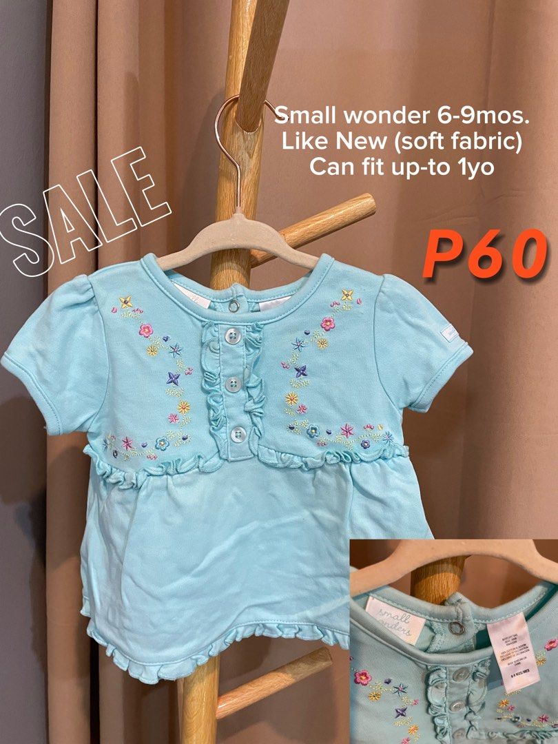 Small Wonders Baby Top (Category: Shirts) located in Caloocan City. Submitted by gorgzel (Listing ID 1436362271, Image 1). Description: - Small Wonders baby top - Soft fabric - Delicate floral embroidery - Button-up front - Ruffled details - Fits babies 6-9 months (can fit up to 1 year).