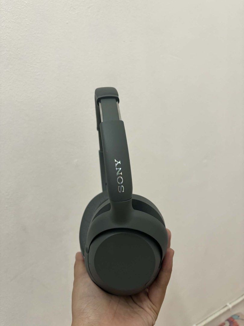 Sony ULT Wear Headphones (Category: Headphones & Headsets) located in Caloocan City. Submitted by angelsshps (Listing ID 1436382843, Image 3). Description: - Sony ULT Wear headphones - Gray color - Includes carrying case, charging cable, and audio cable - Features ULT Power Sound technology - Sony logo on headband.