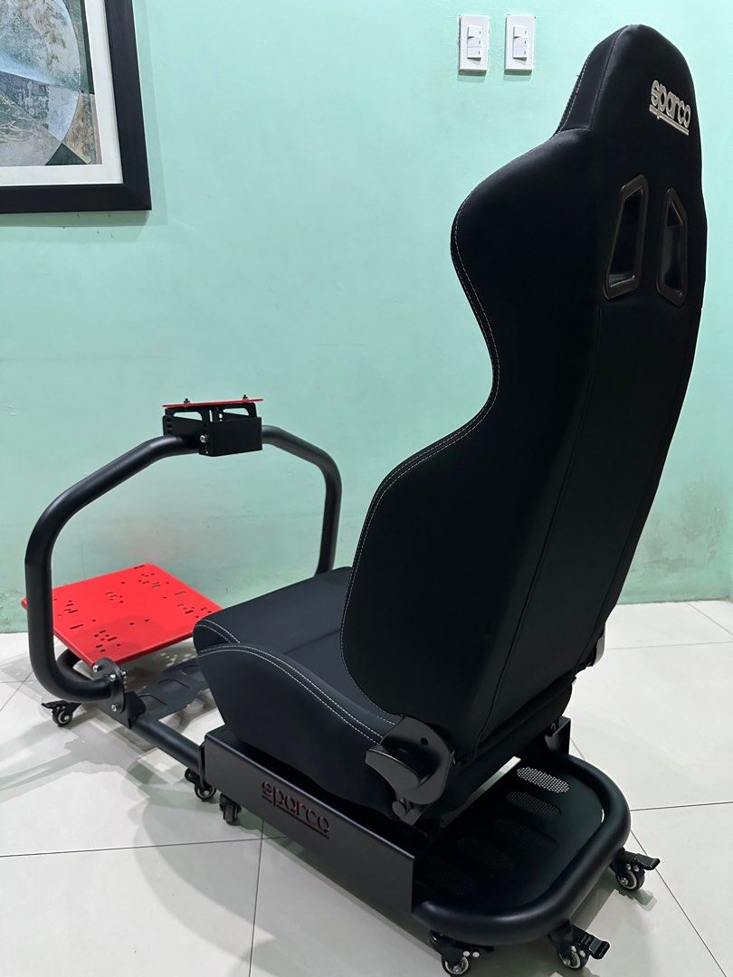 Sparco Evolve Driving Simulator Rig (Category: Controllers) located in Quezon City. Submitted by karllu (Listing ID 1436374254, Image 3). Description: For Sale: Sparco Evolve Driving Simulator Rig -Top-tier Racing Simulator Cockpit Chassis -Orig Black Sparco R100 Racing Seat -Modeled after seats in real racing cars -Compatible with all steering wheels and pedals on the market, including Logitech, Thrustmaster, Moza and Fanatec -Superior High Stre