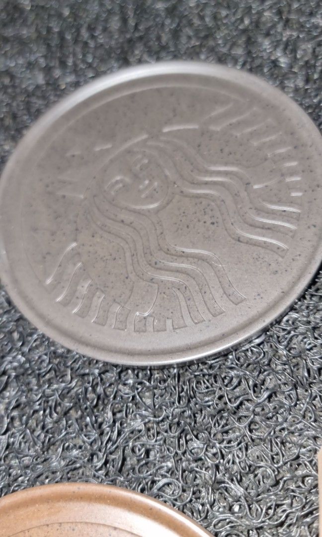 Starbucks Coffee Ground Coaster 3pcs/set Core Essential Collection (Category: Water Bottles & Tumblers) located in Cebu City. Submitted by McCroix (Listing ID 1436405391, Image 3). Description: Starbucks Coffee Ground Coaster 3pcs/set Core Essential Collection Design & Aesthetic •​Embossed Siren Logo: Each coaster features a detailed, raised-line depiction of the classic Starbucks Siren. •​Color Palette: The set comes in earthy, nature-inspired t