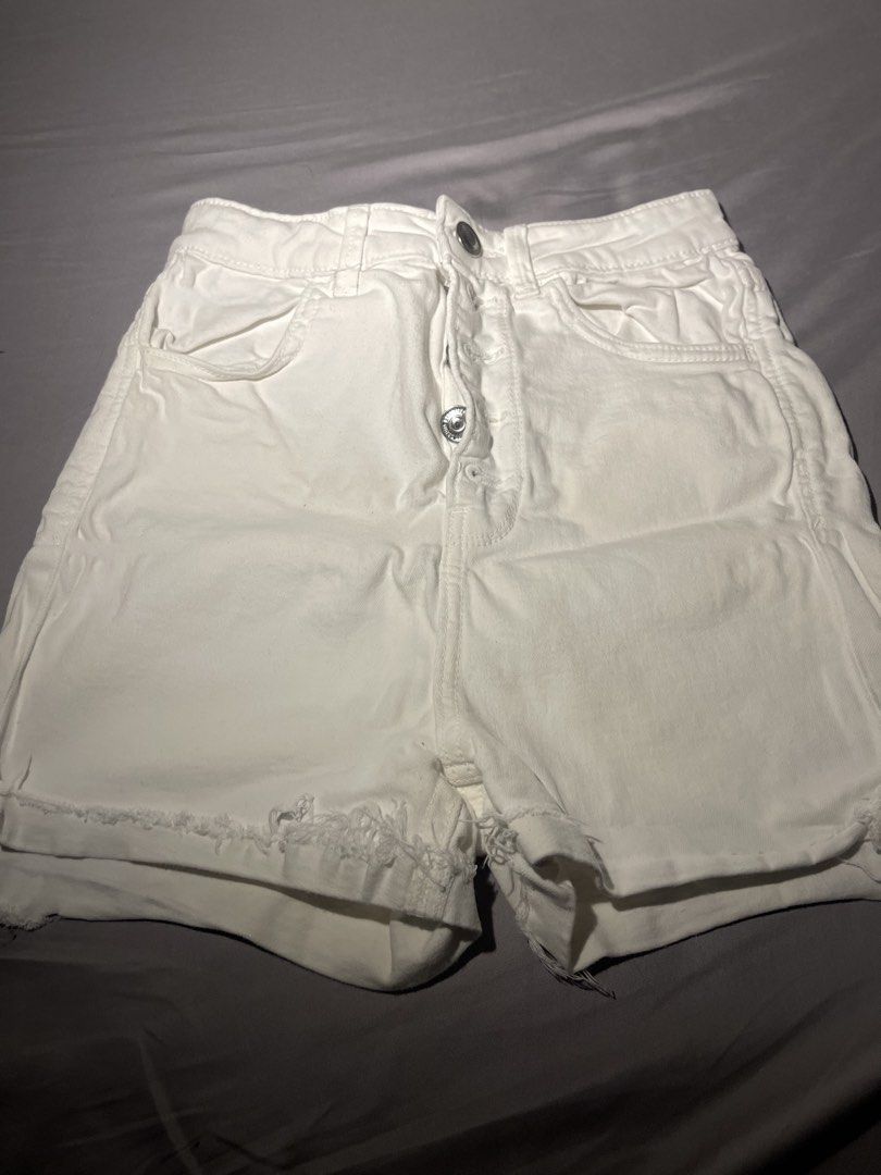 Stradivarius White Ripped Denim Shorts (Category: Shorts) located in Manila. Submitted by dianathrifts (Listing ID 1436021550, Image 3). Description: Dm for more pics. No when worn (the clothes don't fit me) but I can google models with the clothing if needed. Dimensions in photos! Condition: 10/10.