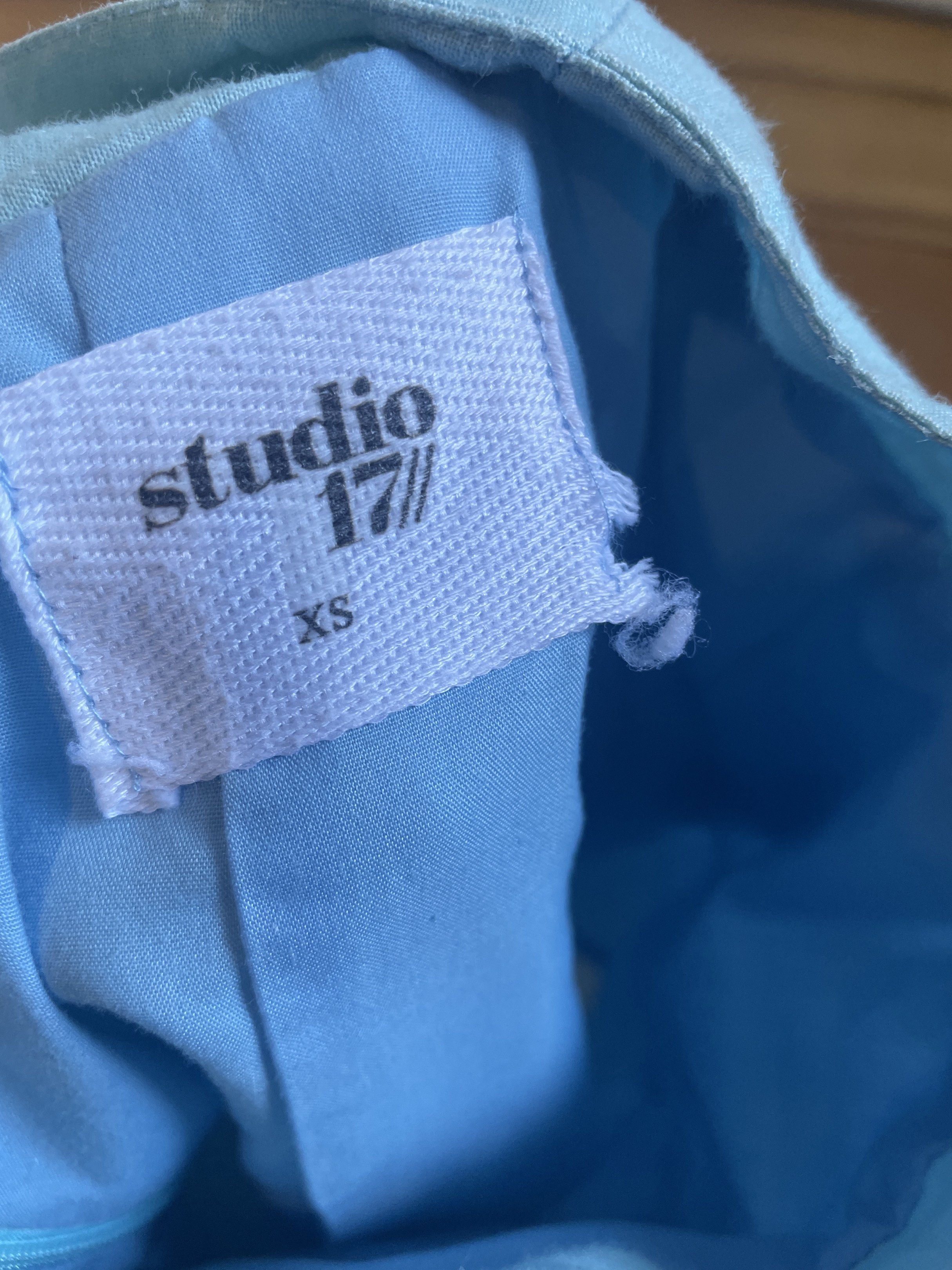 Studio 17 Linen Mini Skirt XS (Category: Skirts) located in San Juan City. Submitted by tabithajam (Listing ID 1436373176, Image 3). Description: - Studio 17 mini skirt - Light blue color - Size: XS - Material: Linen - Features a front slit - Has pockets - Zipper closure at the back - Classic and simple design - Suitable for various occasions No when worn as it no longer fits me :) Shipping arranged by buyer Pick up in Greenhills San Juan.
