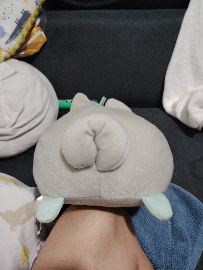 Sumikko Gurashi Frog Plush (Category: Plushies & Soft Toys) located in Makati City. Submitted by jayclutter0976004 (Listing ID 1436370876, Image 3). Description: Adorable Sumikko Gurashi plush features a frog character wearing a cute hood. It has a light green body, brown eyes, and a stitched mouth. The hood is gray with yellow inner ears. It's a soft and cuddly toy, perfect for any Sumikko Gurashi fan or plushie collector..