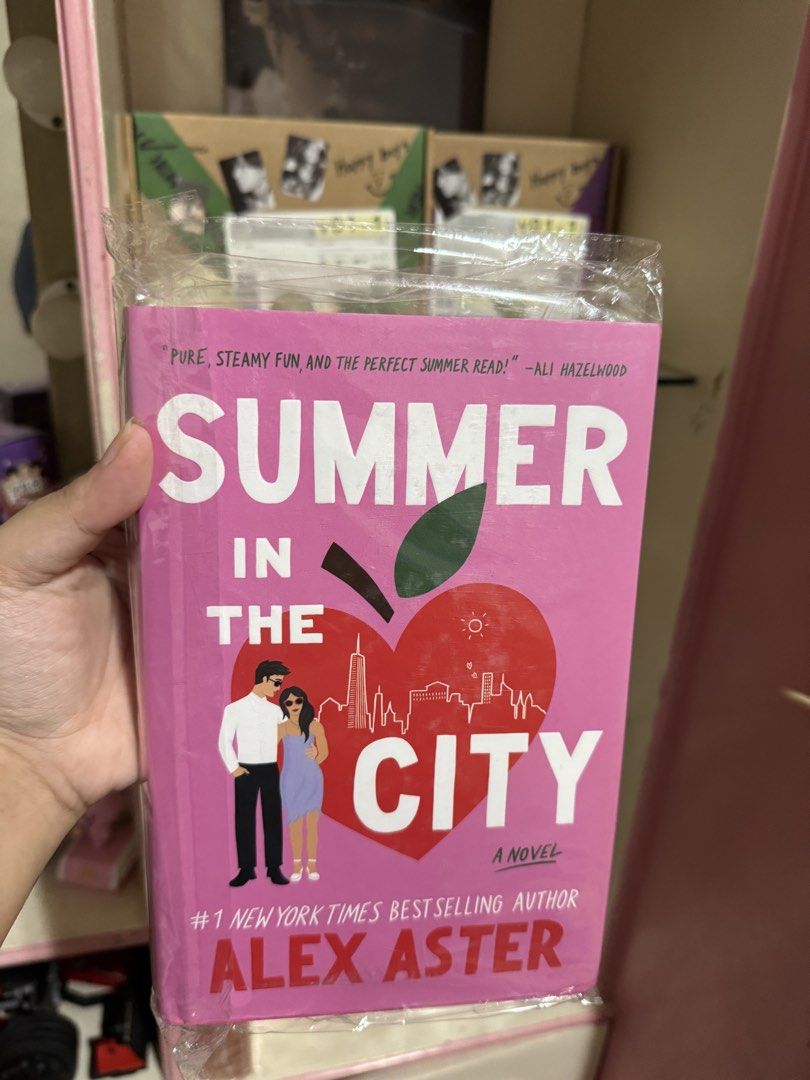 Summer in the City by Alex Aster (Category: Storybooks) located in Rizal. Submitted by alicrtz (Listing ID 1436374959, Image 1). Description: - 'Summer in the City' by Alex Aster - Features a pink cover with a heart-shaped apple design and city skyline. - Includes a quote from Ali Hazelwood. - #1 New York Times Bestselling Author - Perfect summer read!.