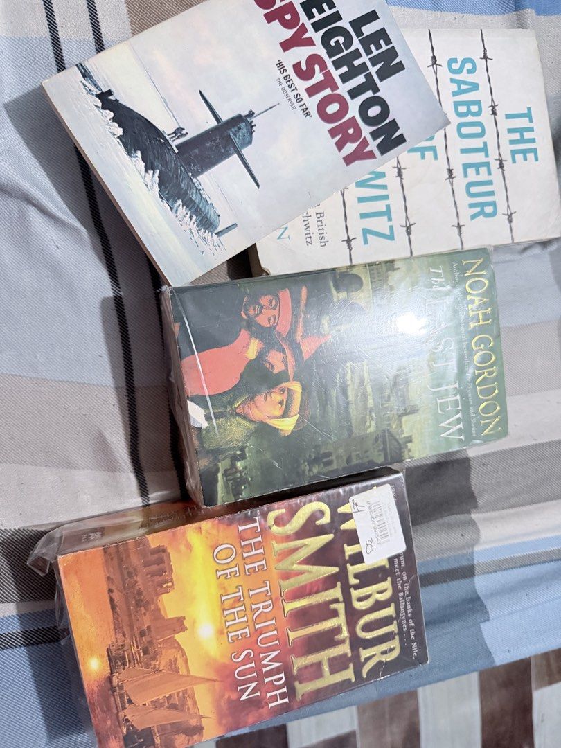 TAKE ALL FOR 49 Assorted Paperback Books (Mixed Genre) (Category: Storybooks) located in Paranaque City. Submitted by napoleon2008 (Listing ID 1436306358, Image 2). Description: - Paperback book collection for sale. - Titles include: - "The Triumph of the Sun" by Wilbur Smith - "Spy Story" by Len Deighton - "The Saboteur of Auschwitz" by Colin Rushton - "Celebration of Discipline" by Richard Foster - "The Last Jew" by Noah Gordon - Some books are