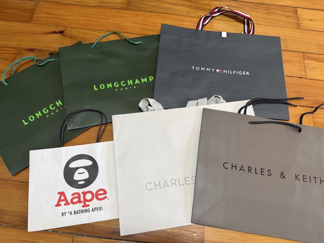 TH , Longchamp , Aape , Charles & Keith Paper Gift Bag (Category: Luxury Bags & Wallets) located in Manila. Submitted by a.c.shop (Listing ID 1436384447, Image 1). Description: TH - 450 Longchamp 2 avail - 450 each Aape ( with yellow stains ) - 150 Charles & Keith ( white color with hole ) - 200 ( dark color ) - 280 .