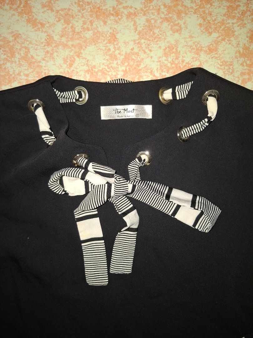 The Best Black Long Sleeve Top (Category: Longsleeves) located in Valenzuela. Submitted by thriftlets (Listing ID 1436324775, Image 2). Description: - Black long sleeve top - Striped accents - Unique eyelet and ribbon design - Striped cuffs.