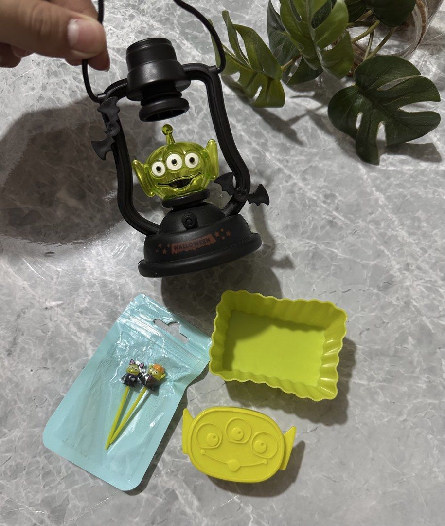 Toy Story Alien Halloween Lantern Set (Category: Character Goods) located in Manila. Submitted by mommabearbento2019 (Listing ID 1436322517, Image 1). Description: - Toy Story Alien Halloween set. - Includes: lantern, container, lid, and 2 food picks. - Lantern features a black frame with Alien face and "Halloween" text. - Great for Halloween or Toy Story fans..