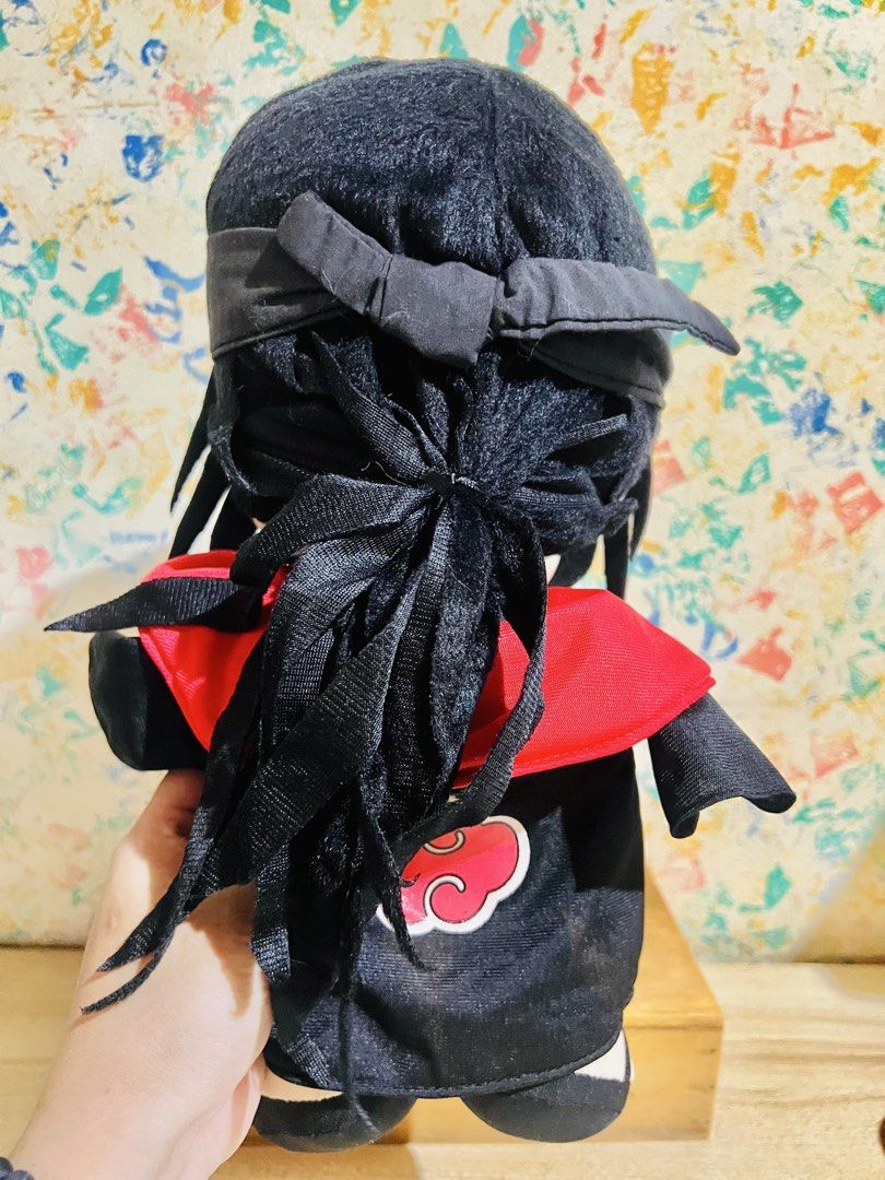 Uchiha Itachi Plush toy (Category: Plushies & Soft Toys) located in Taguig. Submitted by lae.onlineshop (Listing ID 1436465029, Image 3). Description: Uchiha Itachi Plush toy *No label/etiketa/paper tag. May or may not be official. AUTHENTICITY NOT GUARANTEED. *THE COLOR MAY SLIGHTLY DIFFER FROM ACTUAL DUE TO LIGHTING AND/OR SCREEN RESOLUTION. Size: approx 33cm Issue: needs minimal cleaning, nawala yung dikit sa may hair(see photos), AS IS ‼️1 DA