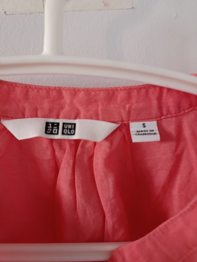 Uniqlo Coral Top - Size S (Category: Blouses) located in Manila. Submitted by stuffsbybrix (Listing ID 1436380135, Image 2). Description: - Uniqlo coral-colored top - Size: S - Design: V-neck, short sleeves - Fabric: Lightweight, ideal for warm weather - Style: Solid color, classic color may vary due to lighting rfs: decluttering .