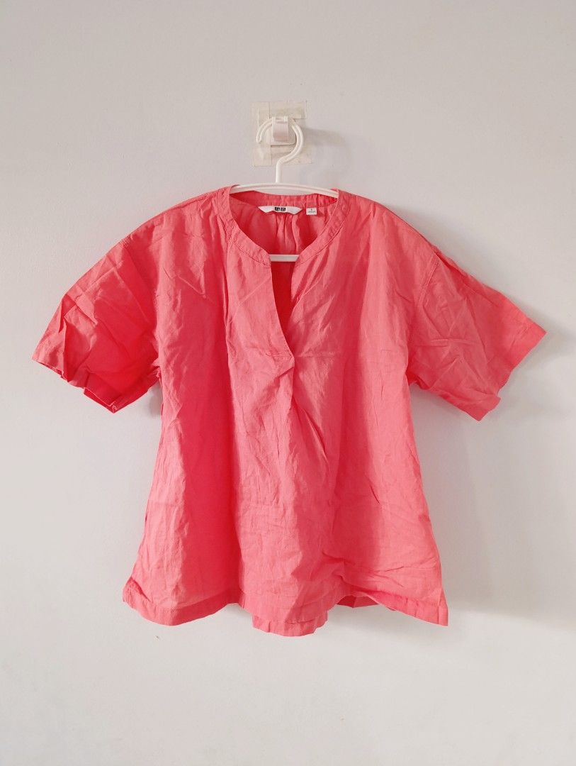 Uniqlo Coral Top - Size S (Category: Blouses) located in Manila. Submitted by stuffsbybrix (Listing ID 1436380135, Image 1). Description: - Uniqlo coral-colored top - Size: S - Design: V-neck, short sleeves - Fabric: Lightweight, ideal for warm weather - Style: Solid color, classic color may vary due to lighting rfs: decluttering .