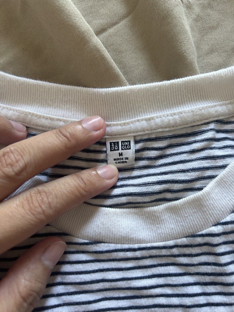 Uniqlo Striped Crop Top - Medium (Category: Shirts) located in Binan City. Submitted by missrandomthings (Listing ID 1436364959, Image 2). Description: - Uniqlo crop top - Classic striped design - White collar - Size: Medium - Made in China - Short sleeves - Comfortable fit - Perfect for everyday wear.