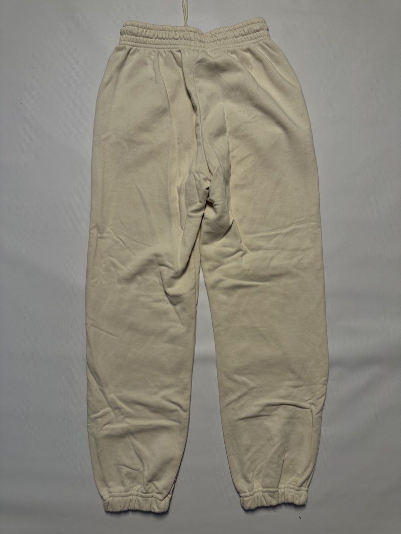 Uniqlo Sweatpants - Beige - Size S (Category: Other Bottoms) located in Manila. Submitted by johnedel_james (Listing ID 1436431693, Image 2). Description: - Uniqlo sweatpants in beige - Size: S (Waist: 60-66cm) - Features: - Drawstring waist - Side pockets - Embroidered detail - Material: 70% cotton, 30% polyester - Made in China.