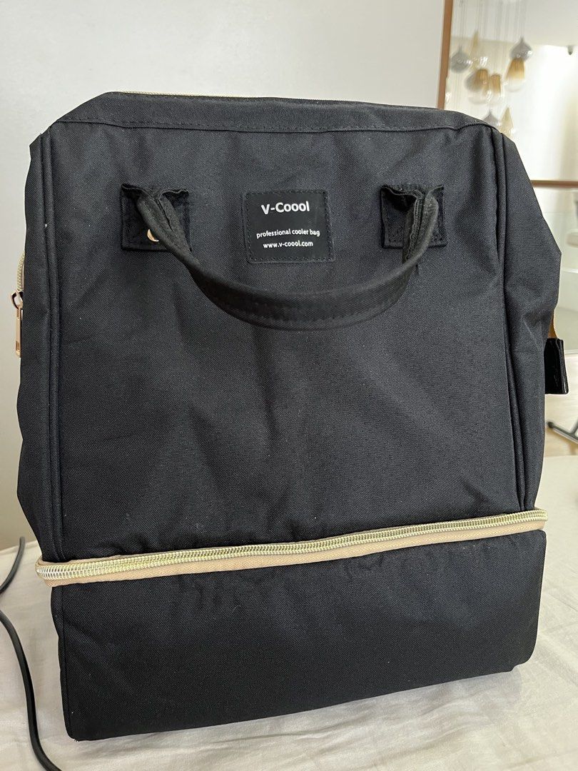 V-coool Professional Cooler Bag (Category: Breastfeeding & Bottle Feeding) located in San Jose del Monte. Submitted by mmmsr2647 (Listing ID 1436385766, Image 1). Description: - V-coool Professional Cooler Bag - Stylish black exterior - Convenient top handle - Separate insulated compartments for optimal cooling - Multiple interior compartments for organization - Secure zipper closures for both main and bottom compartments - Designed to keep items