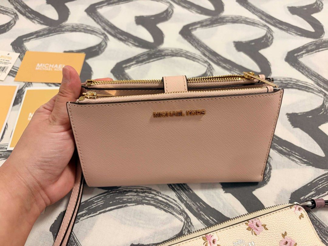 Wallet (Category: Luxury Bags & Wallets) located in Bulacan. Submitted by anne_reyes (Listing ID 1436415976, Image 3). Description: MK and Couch wallet pouch 6,000 for both.