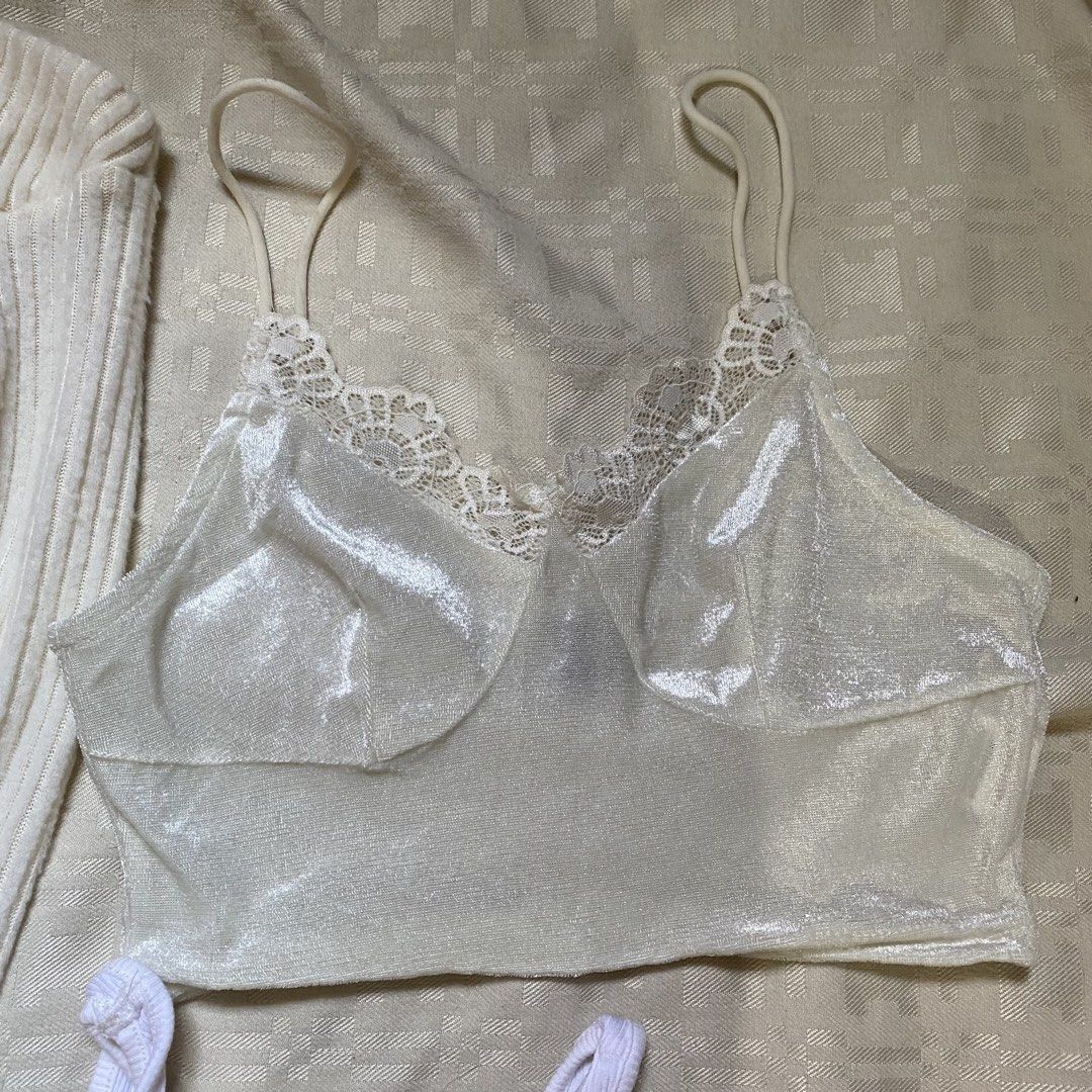 White Tops Bundle (Category: Blouses) located in Paranaque City. Submitted by mschabumenlag (Listing ID 1436340473, Image 2). Description: - White Top Bundle: - Includes: Off-shoulder long sleeve top with asymmetrical hem, lace trim camisole, and devil heart graphic tank top. - Features: Spaghetti straps on camisole, round neckline on tank top. - Condition: Good..