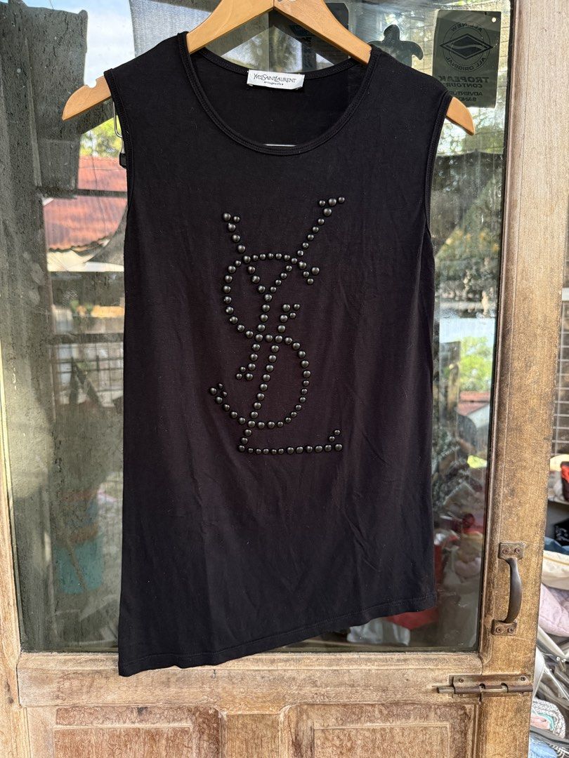 Yves Saint Laurent Tank Top (Category: Sleeveless) located in Manolo Fortich. Submitted by thriftacktoe34 (Listing ID 1436423473, Image 1). Description: Excellent condition Color may vary due to lighting Color rate 9.5/10 Size Dimes W16 x L24 inches Issue: may scratch yung ibang beads FREE shipping fee.