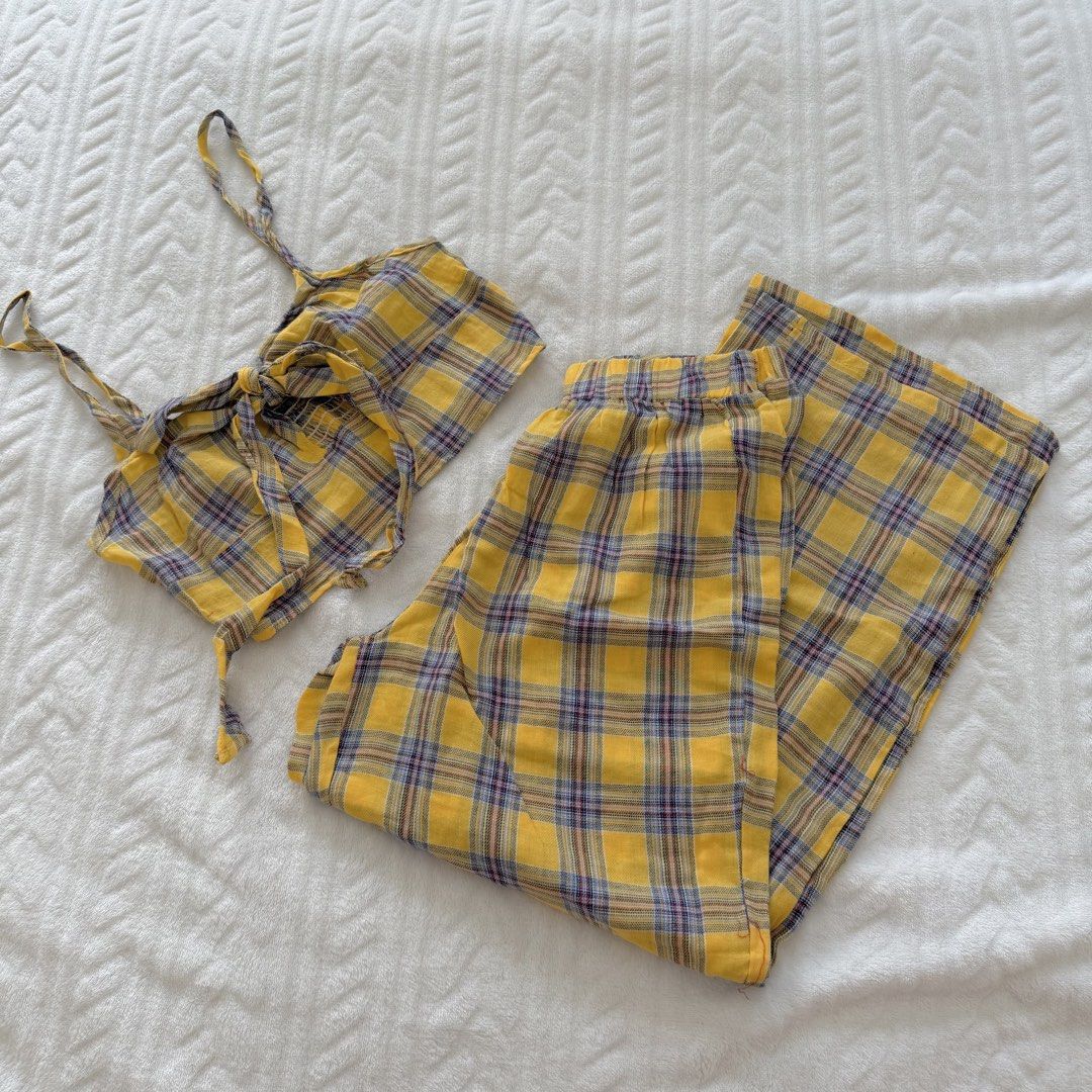 Zaful Plaid Crop Top and Pants Set (Category: Sets or Coordinates) located in Pasig City. Submitted by sichi.ph (Listing ID 1436369103, Image 1). Description: - Zaful yellow plaid two-piece set. - Includes a crop top and wide-leg pants. - Crop top features: spaghetti straps, tie-front. - Pants feature: elastic waistband. - Fabric: Lightweight, ideal for warm weather. - Size tag is visible in the photos..