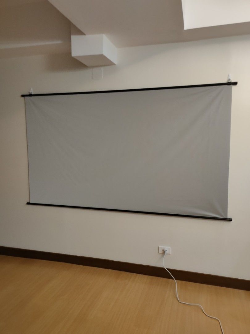 100-inch Anti-light Projector Screen (Category: Projectors) located in Makati City. Submitted by sanmyshino (Listing ID 1436585337, Image 3). Description: -Used Once - 100-inch anti-light projector screen - 16:9 aspect ratio - Dimensions: 125cm x 221cm - Elegant black frame - Gray screen for enhanced image quality - Ideal for home theater setups and professional presentations.