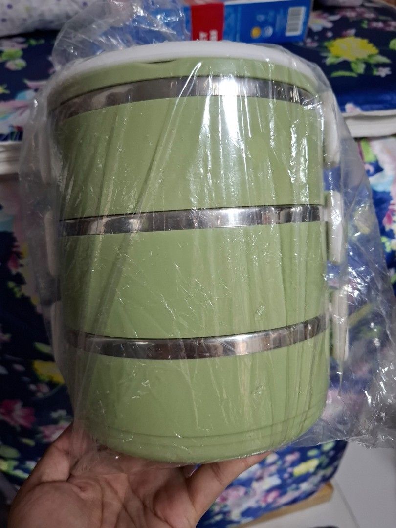 3-Tier Insulated Lunch Box with Handle (Category: Food Organization & Storage) located in Quezon City. Submitted by ana-chan (Listing ID 1436640703, Image 2). Description: - Three-tier design for food separation - Insulated lunch box - Green with silver accents - Includes a handle for easy carrying - Secure clips to keep food safe - Brand new, still in original packaging.
