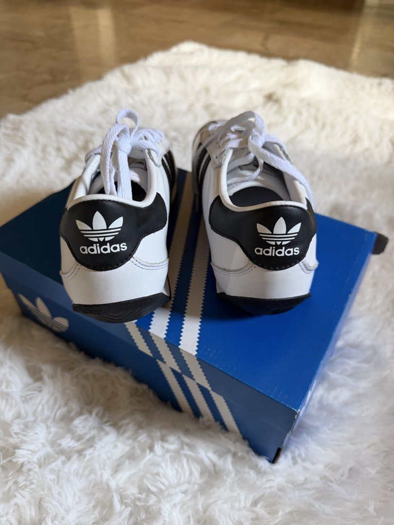 Adidas Country II Sneakers (Category: Sneakers) located in Pasig City. Submitted by declutterwithe (Listing ID 1436541289, Image 2). Description: - Adidas Country II sneakers - White with black stripes - Size: US 4.5 men’s | US 6 women’s - Includes original box .