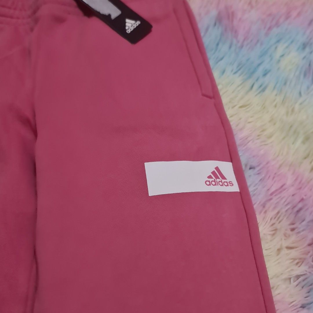 Adidas pink jogger track pants (Category: Activewear) located in Las Pinas. Submitted by assortedkidzstuffs (Listing ID 1436536574, Image 3). Description: bnew with tag original high quality made in India on tag (ang ganda ng material compared to other Adidas pants) size 160 on tag (fits teens and xs to s adult).