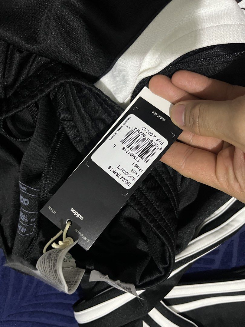 Adidas Tiro24 Track Pants Black/White (Category: Joggers) located in Manila. Submitted by allaboutthemhobbies_ (Listing ID 1436554702, Image 2). Description: bought it for 2500 masikip sakin selling for only 1300 - Adidas Tiro24 track pants - Color: Black with white stripes and accents - Slim fit - Size: S - Features Adidas logo - Includes original tags - Made in Vietnam.