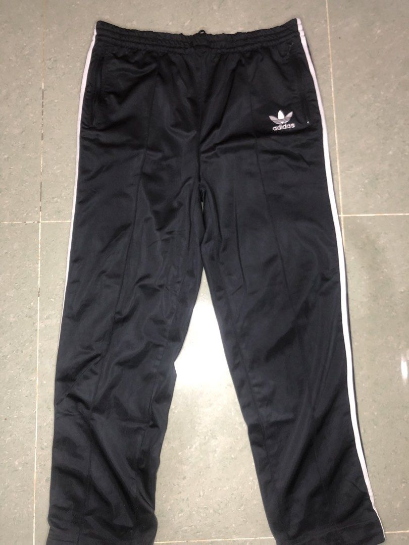 Adidas Track Pants - Black with White Stripes (Category: Activewear) located in Midsayap. Submitted by karldonor01258 (Listing ID 1436499928, Image 1). Description: Classic Adidas track pants in black with white stripes. Features the Adidas logo on the leg and a size M tag. Includes a drawstring waist and side pockets. There is a small hole on the back of the pants. Perfect for casual wear or workouts. -Dimes:W38 L42 -leg hole:8.