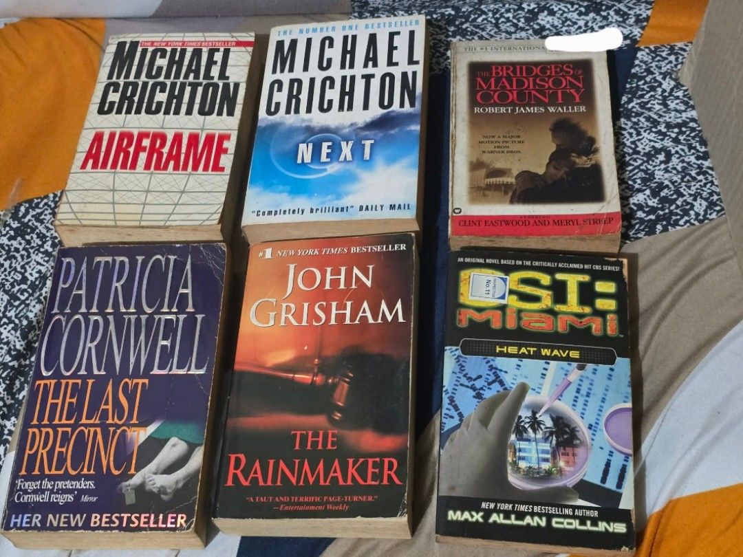 Assorted Paperback Books (Category: Storybooks) located in Pasig City. Submitted by powiskonmaried (Listing ID 1436558496, Image 1). Description: Hi! Selling these books to declutter. These are pre-loved books. Expect shelf-wear, tanning, creases. - Collection of assorted paperback books. - Titles include: "The Last Precinct", "Airframe", "The Rainmaker", "Next", "Heat Wave", "Set in Stone", "The Door to December", "My Life", "Lucia Lucia", "True