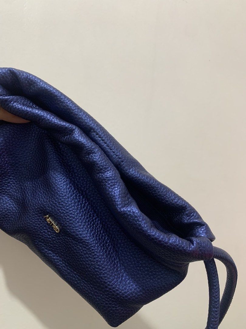 AZTRID Micro Dumpling Bag / Crossbody / Sling / Pouch (Metallic blue) (Category: Cross-body Bags) located in Quezon City. Submitted by 6omsells (Listing ID 1436489087, Image 2). Description: AZTRID MICRO DUMPLING BAG Color: Metallic blue Material: Vegan leather - Magnetic closure - Interior lined with canvas - Can be worn as a crossbody, pouch, or shoulder bag Micro size: 8cm (W) x 16cm (H) x 23cm (L) - Fits mobile phones ONLY USED ONCE. In excel