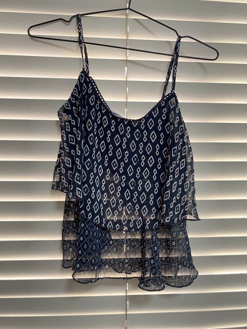 Bershka Diamond Print Top - Size S (Category: Others Tops) located in Cavite. Submitted by prelovedclothesofzoe (Listing ID 1436551249, Image 1). Description: - Bershka top with a unique diamond print. - Size: Small - Design: Layered with spaghetti straps. - Fabric: Lightweight and flowy. - Versatile: Suitable for casual and evening wear..