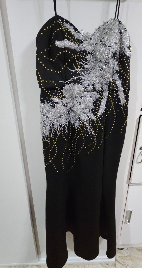 Black Embellished Evening Dress (Category: Evening dresses & gowns) located in Caloocan City. Submitted by rm.diaz (Listing ID 1436497006, Image 2). Description: - Black evening dress - Intricate silver embellishments - Sweetheart neckline - Spaghetti straps - Fitted bodice - Subtle mermaid silhouette - Zipper closure - Ideal for special occasions.
