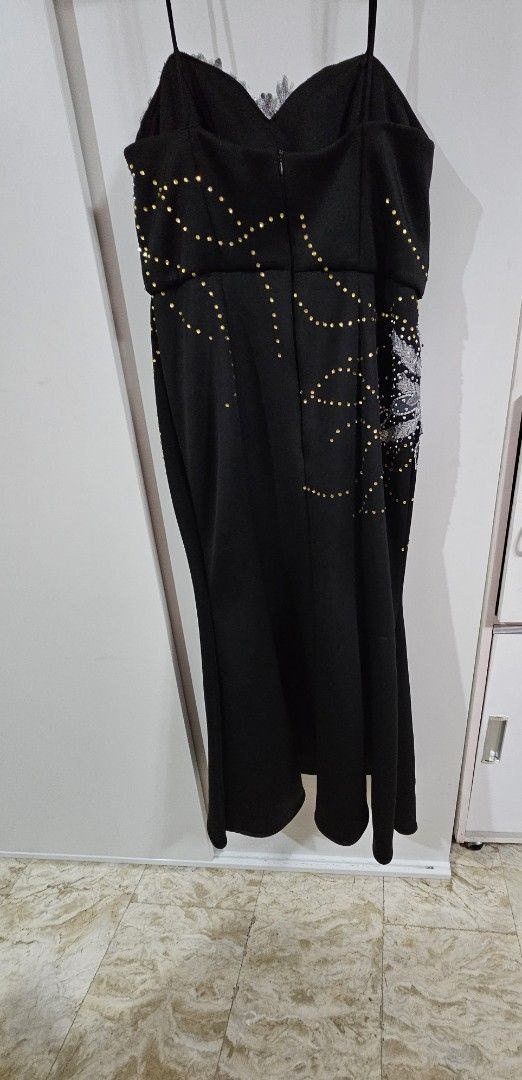 Black Embellished Evening Dress (Category: Evening dresses & gowns) located in Caloocan City. Submitted by rm.diaz (Listing ID 1436497006, Image 3). Description: - Black evening dress - Intricate silver embellishments - Sweetheart neckline - Spaghetti straps - Fitted bodice - Subtle mermaid silhouette - Zipper closure - Ideal for special occasions.