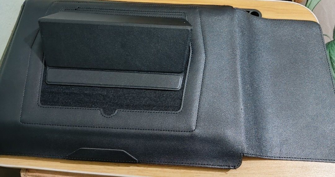 Black Laptop Sleeve with Accessory Pouch (Category: Laptop Bags & Sleeves) located in Manila. Submitted by rej.24 (Listing ID 1436647051, Image 3). Description: - Black laptop sleeve with matching accessory pouch - Flap closure - Built-in stand - Multiple interior compartments for organization - Made of leather-like material.