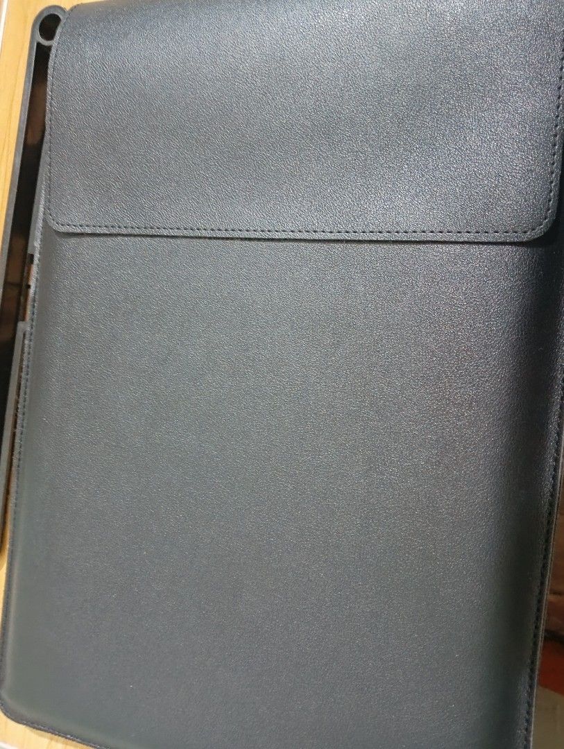 Black Laptop Sleeve with Accessory Pouch (Category: Laptop Bags & Sleeves) located in Manila. Submitted by rej.24 (Listing ID 1436647051, Image 2). Description: - Black laptop sleeve with matching accessory pouch - Flap closure - Built-in stand - Multiple interior compartments for organization - Made of leather-like material.