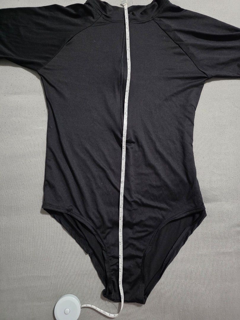 Black Rashguard (Category: Rash guard) located in Pasig City. Submitted by plussizedpixie (Listing ID 1436552835, Image 3). Description: - measurements shown in pics - very thin material - no pads.