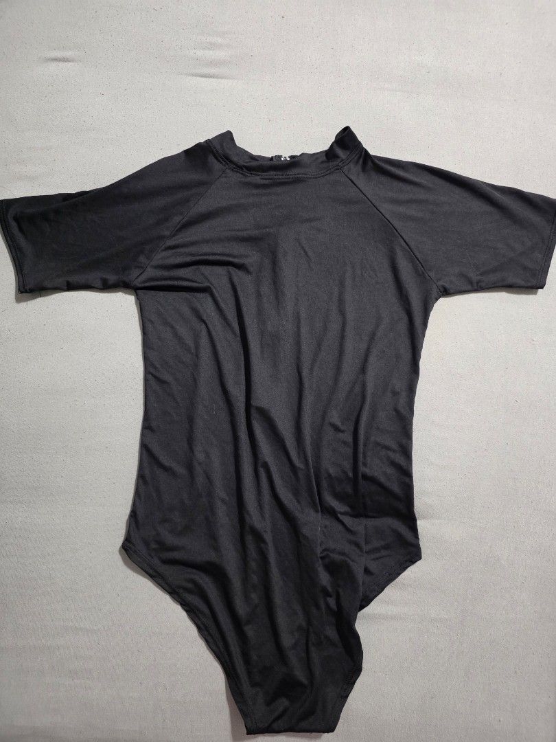 Black Rashguard (Category: Rash guard) located in Pasig City. Submitted by plussizedpixie (Listing ID 1436552835, Image 1). Description: - measurements shown in pics - very thin material - no pads.