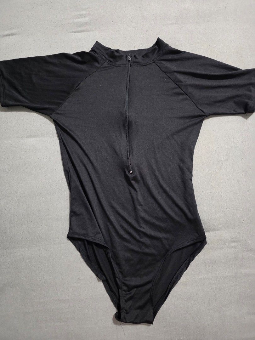Black Rashguard (Category: Rash guard) located in Pasig City. Submitted by plussizedpixie (Listing ID 1436552835, Image 2). Description: - measurements shown in pics - very thin material - no pads.