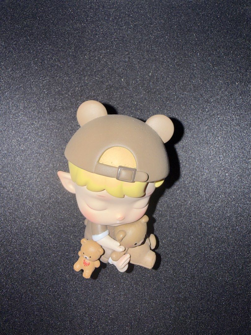 Pop Mart Hacipupu Growth Diary Three Bears (Category: Designer & Blind Box Toys) located in Quezon City. Submitted by carmelloz78155 (Listing ID 1436497074, Image 1). Description: - Adorable figurine - Features a character with a bear-eared cap - Holding two teddy bears - Color scheme: light brown and beige - Blind box item (unique collectible) - Great for display or gifting.