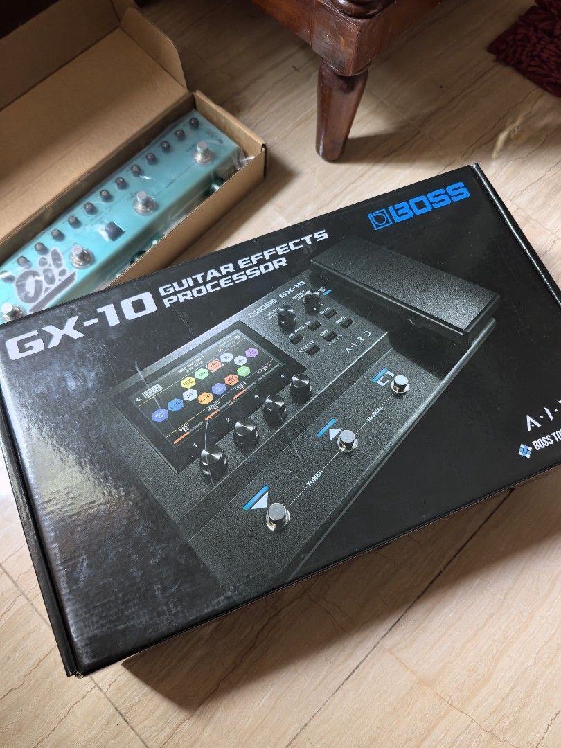 Boss GX-10 Guitar Effects Processor (Category: Musical Instruments) located in Carigara. Submitted by canel828 (Listing ID 1436648512, Image 3). Description: - Boss GX-10 Guitar Effects Processor - Brand new, unused condition - Includes original box - Features Boss Tone Exchange logo - Multi-effects unit with screen, knobs, and buttons.
