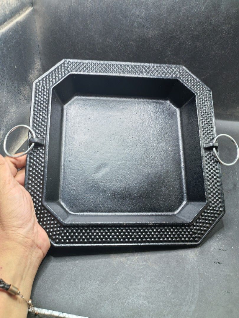 Cast-Iron Rectangular Pan (Category: Other Kitchenware & Tableware) located in Cebu City. Submitted by dudes_villanueva (Listing ID 1436474083, Image 2). Description: Cast-Iron Rectangular Pan Good as New. Very Heavy 📌 Distinctive studded or hobnail pattern along the border and attached metal handles on two sides, often found as part of antique or decorative kitchenware sets. 📌 Material: Heavy-duty cast iron. 📌 Design: Octagonal outer shape wi