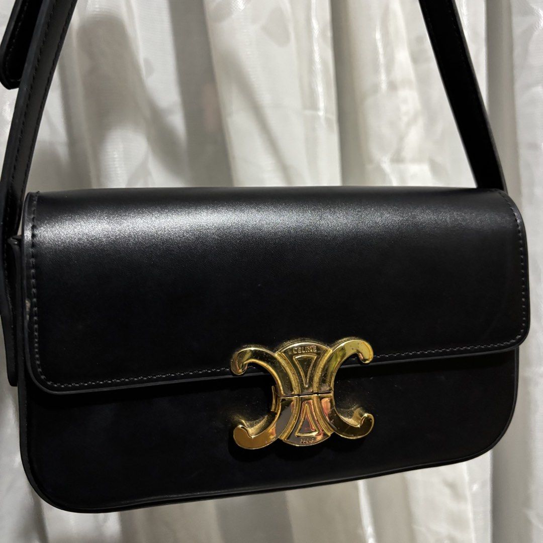CELINE CLASSIQUE TRIOMPHE BAG BLACK (Category: Luxury Bags & Wallets) located in Paranaque City. Submitted by myunsterious (Listing ID 1436585712, Image 2). Description: - Celine Triomphe shoulder bag - Color: Black - Gold-tone clasp with Celine logo - Adjustable strap - Interior: Black with Celine Paris logo - Gold buckle detail on strap.